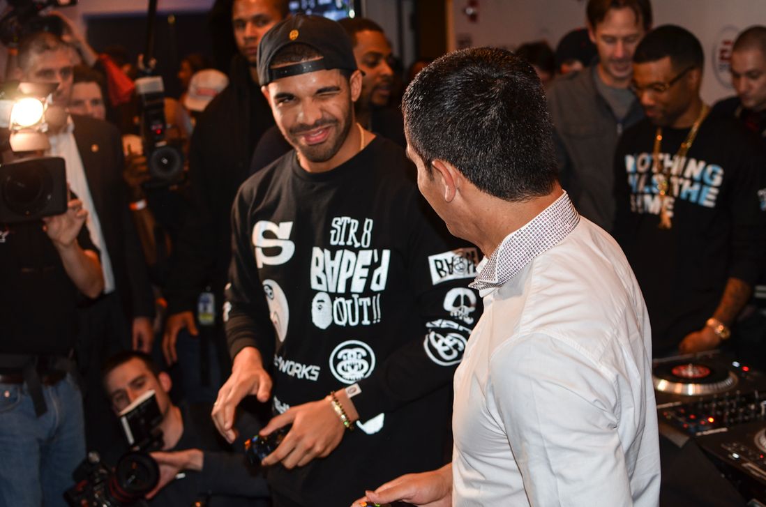 Drake winks at Tim Cahill before they battle in FIFA 14.
